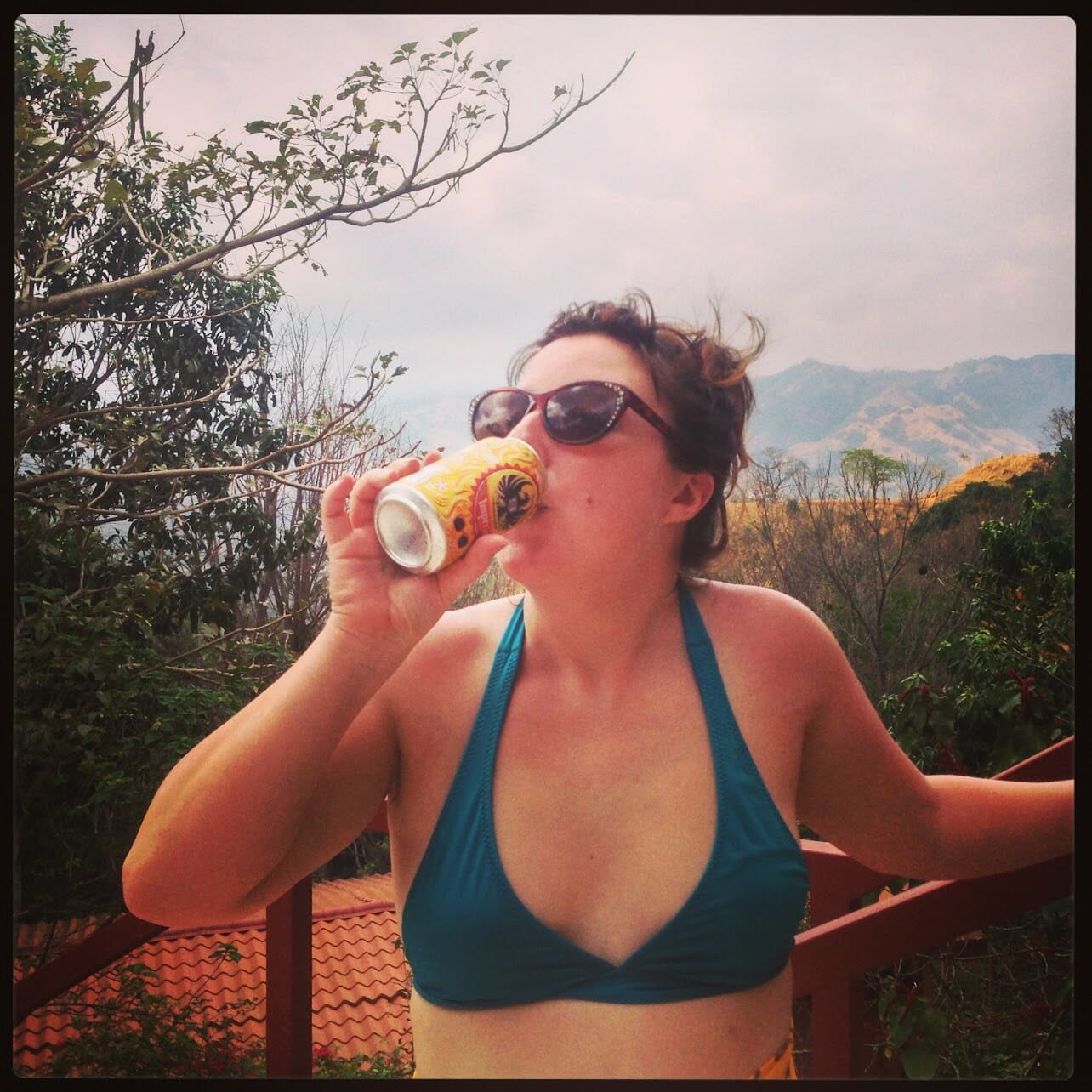 Kindra, in the olden days, drinking a beer in costa rica.