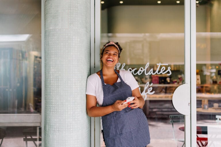 Cafe Owner Outside Restaurant